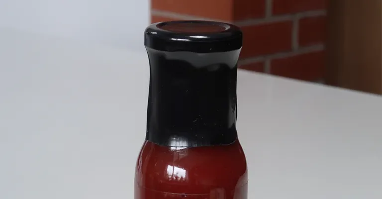 Plastic-free Shrink Sleeve - Eco Friendly Product Packaging on sauce bottle top